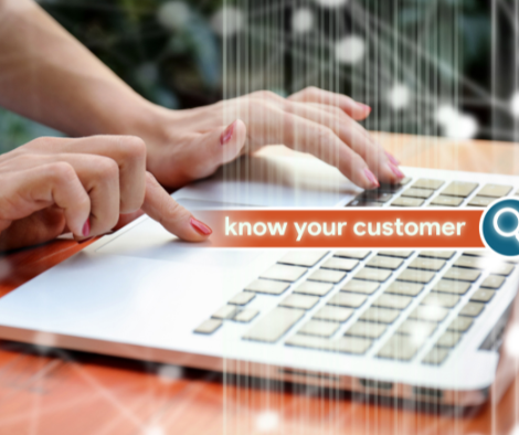 Image of a person using a laptop and a text on top depicting a search bar saying: "know your customers"