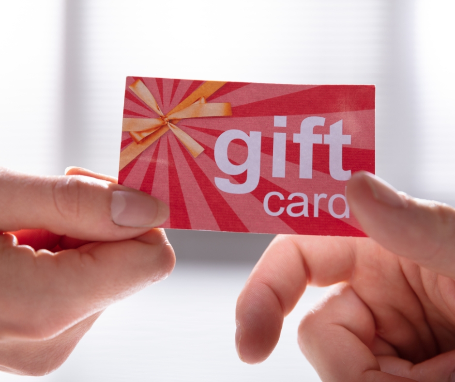 person gifting a gift card