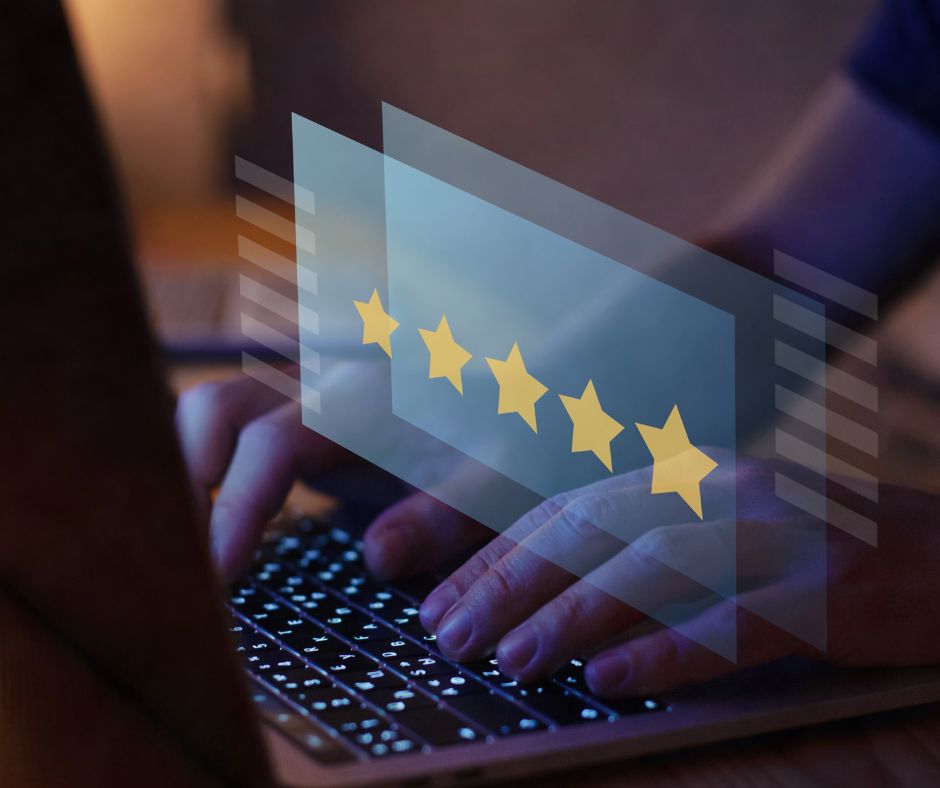 image showing someone on a laptop doing review monitoring on a 5-star review