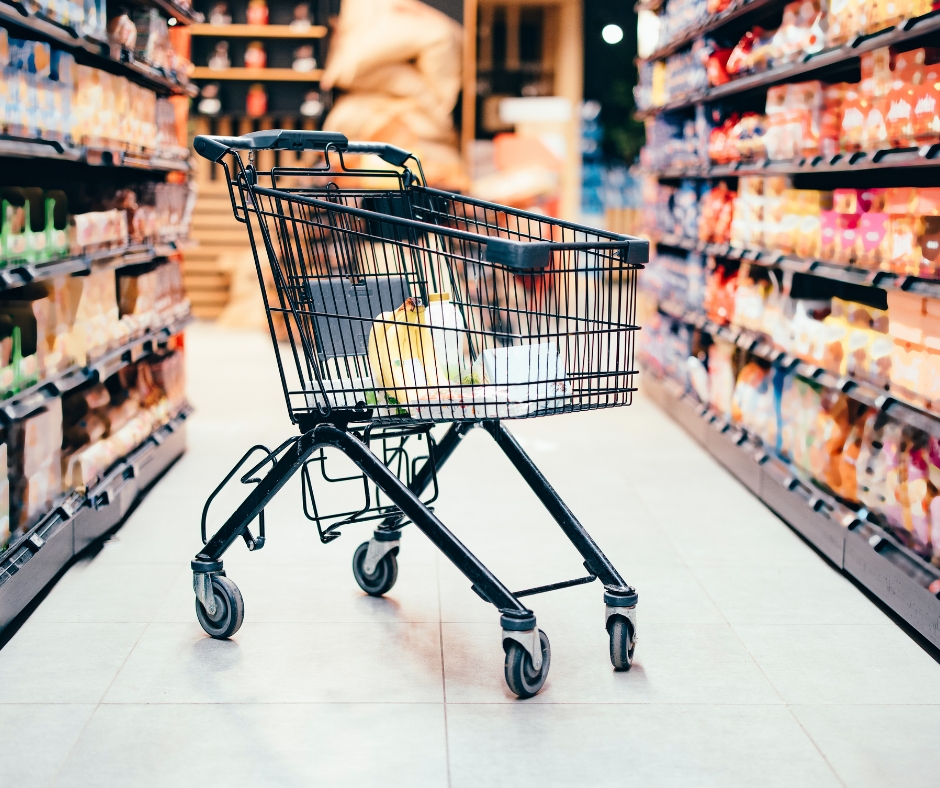 image depicting a shopping cart abandoned in a shop aisle