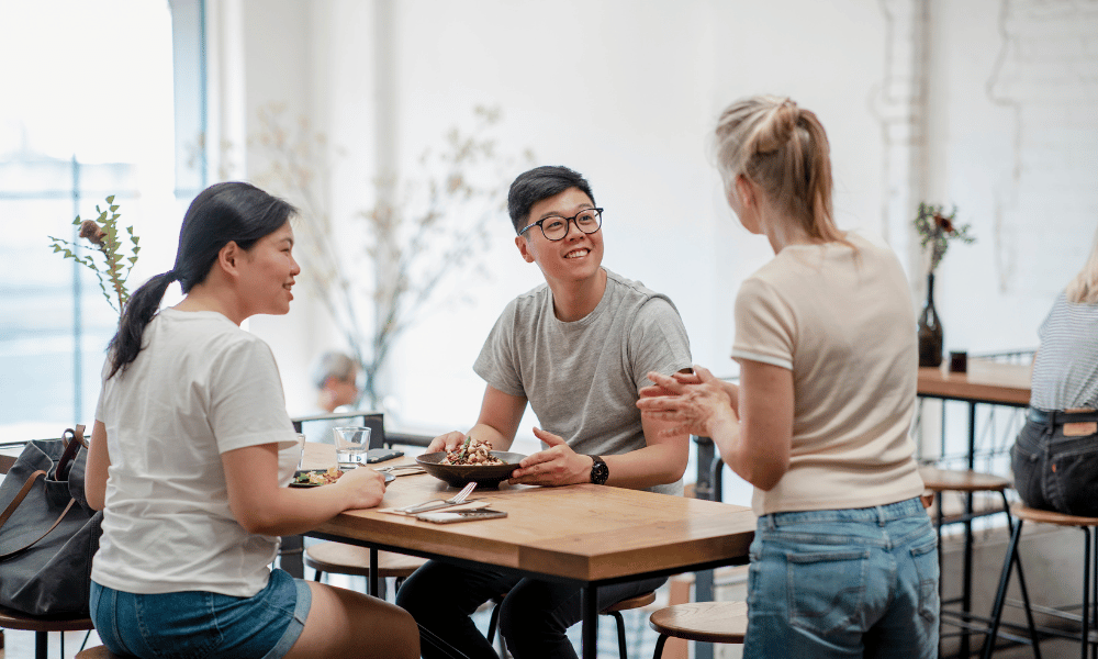 waiter talking to customers